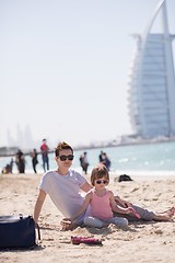 Image showing Mom and daughter on the beach