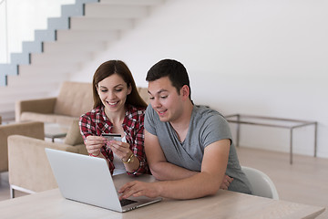 Image showing happy young couple buying online