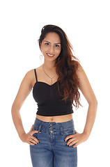 Image showing Happy smiling woman in a corset and jeans