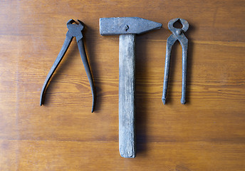 Image showing old tools hammer and tongs