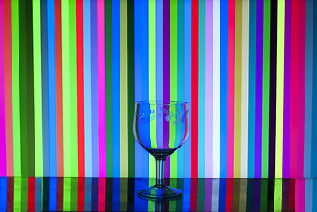 Image showing glass goblet on stripes background