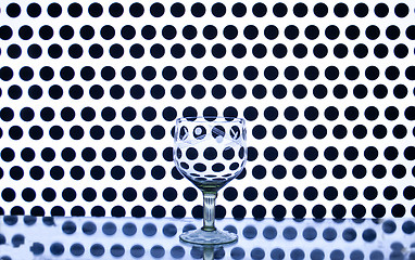 Image showing Glass wine glass on a background of circles