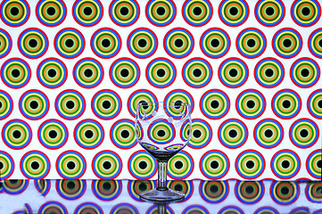 Image showing glass wine glass on colored background circles