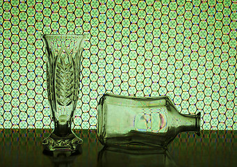 Image showing transparent vase and recumbent bottle