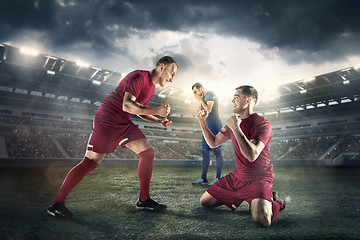 Image showing Happiness football players after goal on the field of stadium