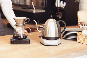 Image showing Barista, cafe, making coffee, preparation and service concept