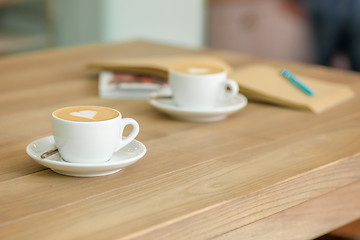 Image showing A table setting for coffee on the counter at a coffee house