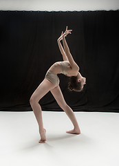 Image showing Young teen dancer on white floor background.