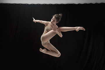 Image showing Young teen dancer on white floor background.