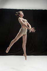 Image showing Young teen dancer on white floor background.