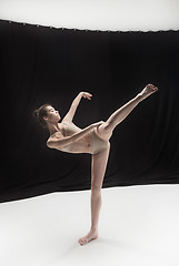 Image showing Young teen dancer on white floor background.