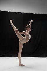 Image showing Young teen dancer on white floor background.