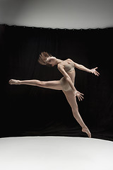 Image showing Young teen dancer on white floor background.