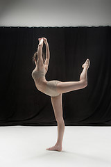 Image showing Young teen dancer on white floor background.