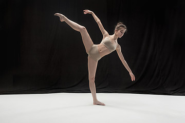 Image showing Young teen dancer on white floor background.