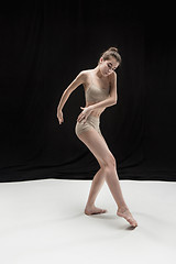 Image showing Young teen dancer on white floor background.