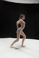 Image showing Young teen dancer on white floor background.