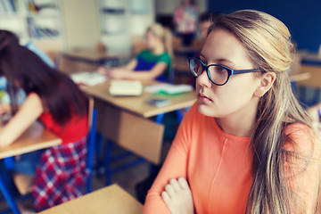 Image showing student girl in eyeglasses at school lesson