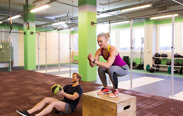 Image showing woman and man with medicine ball exercising in gym