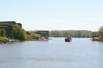 Image showing Red and black boat sailing around Suomenlinna 