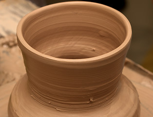 Image showing Process of making clay vase on pottery wheel