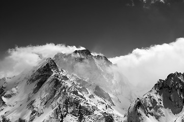Image showing Black and white view on snow winter mountains in clouds