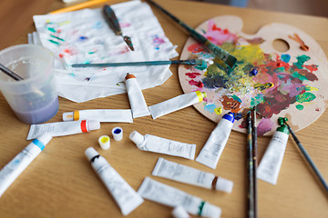 Image showing palette, brushes and paint tubes on table