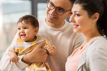 Image showing happy family with baby daughter at home