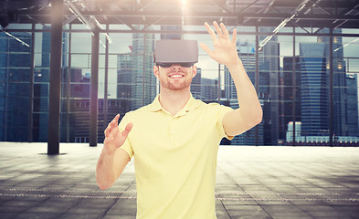 Image showing happy man in virtual reality headset or 3d glasses