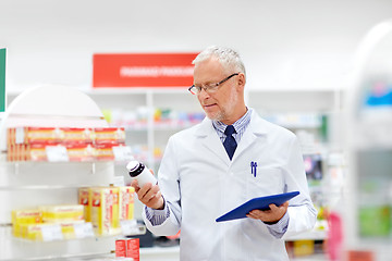 Image showing senior with tablet pc at pharmacy