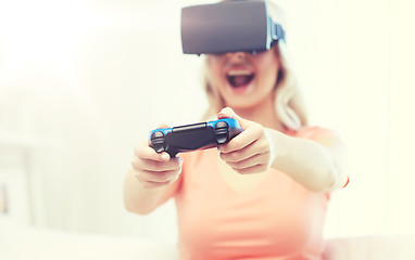 Image showing woman in virtual reality headset with controller