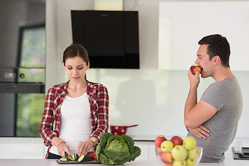 Image showing Young handsome couple in the kitchen