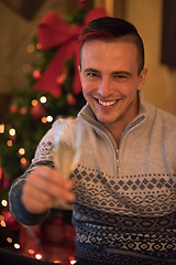 Image showing Happy young man with a glass of champagne