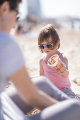 Image showing Mom and daughter on the beach