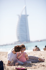 Image showing Mom and daughter on the beach