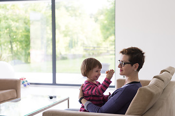 Image showing mother and cute little girl enjoying their free time