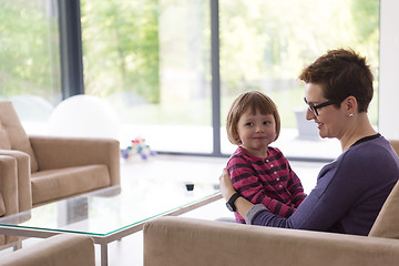 Image showing mother and cute little girl enjoying their free time