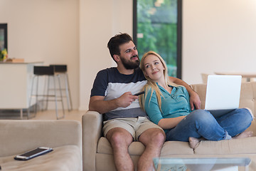 Image showing young happy couple relaxes in the living room