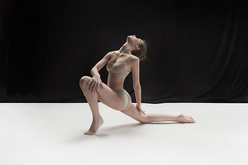 Image showing Young teen dancer on white floor background.