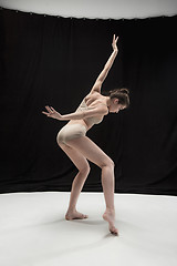 Image showing Young teen dancer on white floor background.