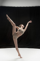 Image showing Young teen dancer on white floor background.