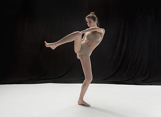 Image showing Young teen dancer on white floor background.