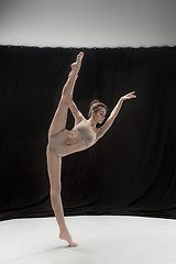 Image showing Young teen dancer on white floor background.