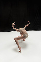 Image showing Young teen dancer on white floor background.