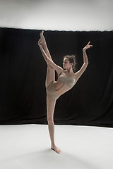 Image showing Young teen dancer on white floor background.