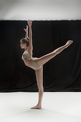 Image showing Young teen dancer on white floor background.