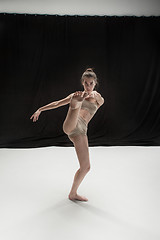 Image showing Young teen dancer on white floor background.