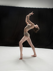 Image showing Young teen dancer on white floor background.