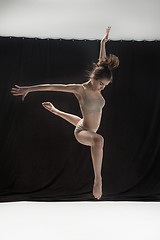 Image showing Young teen dancer on white floor background.