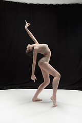 Image showing Young teen dancer on white floor background.